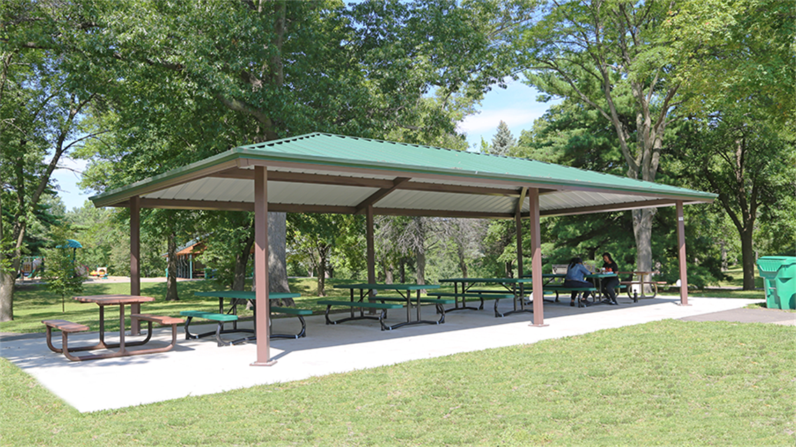 Central picnic shelter with picnic tables at Oak Hill Park
