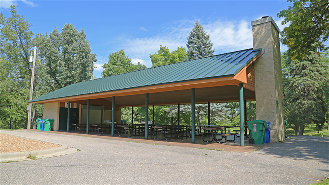 Main picnic shelter with picnic tables at Oak Hill Park