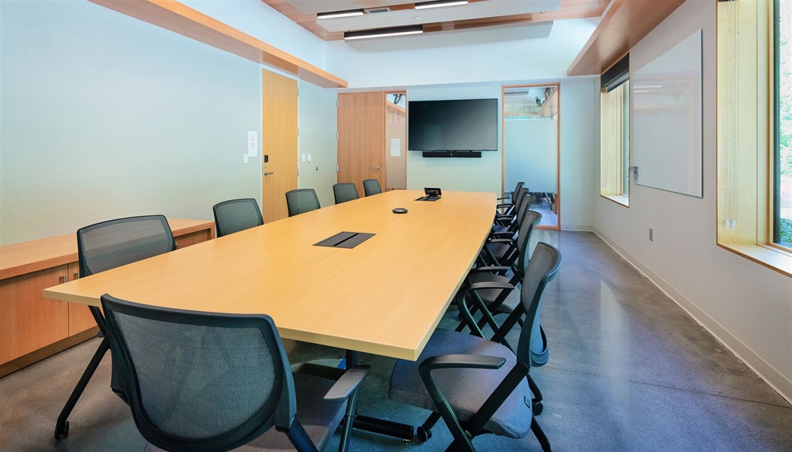 Table and chair setup in maple conference room